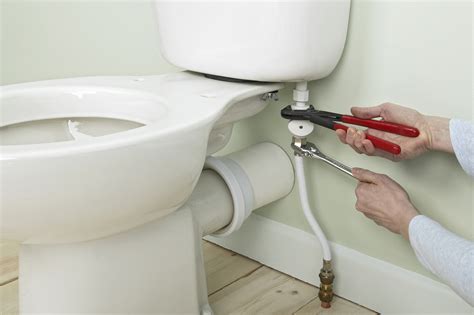 Turn the knob on your toilet's hose counterclockwise to cut off the water supply, then hold down the flush lever to completely drain the tank. Remove the supply hose and loosen the bolts inside the tank. Then lift the tank from the toilet. Add the tank gasket to the large bottom hole in the new tank.